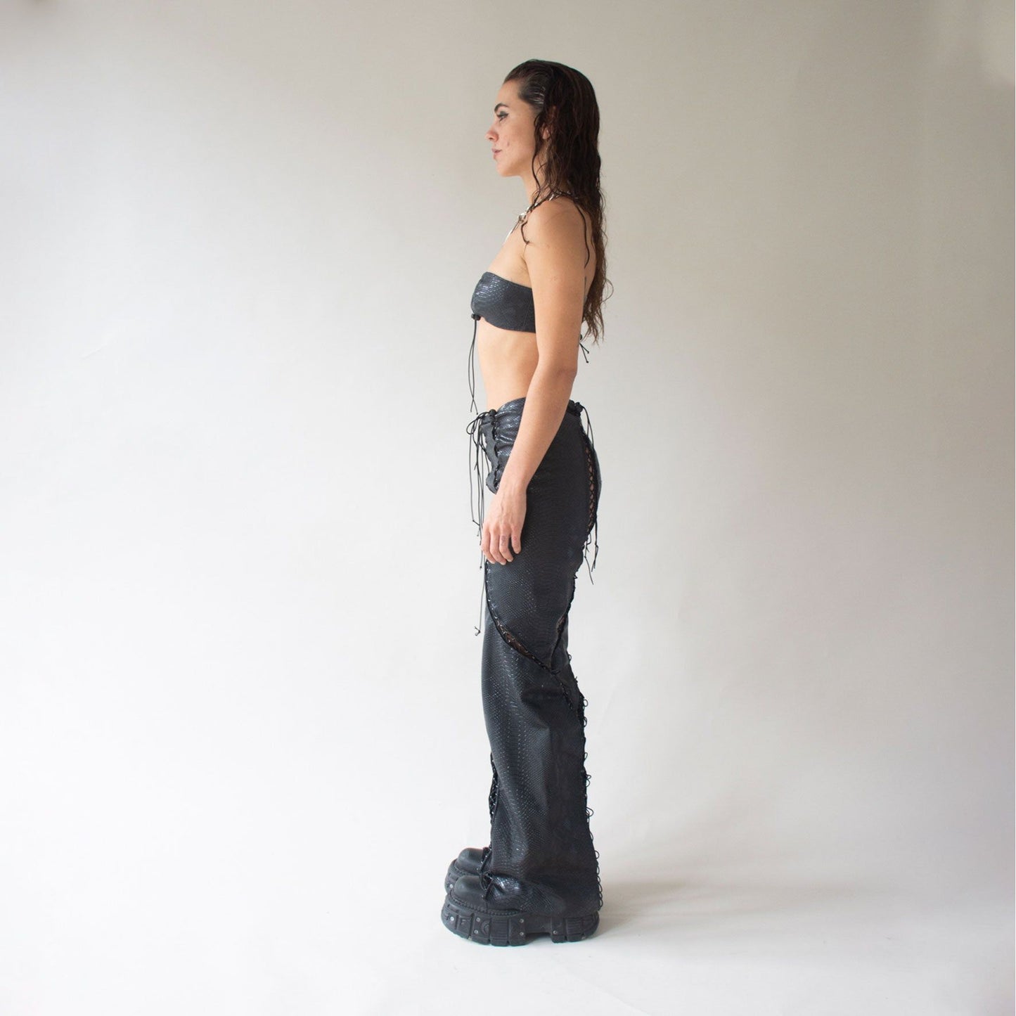 Asymmetrical banded corset pant in black color