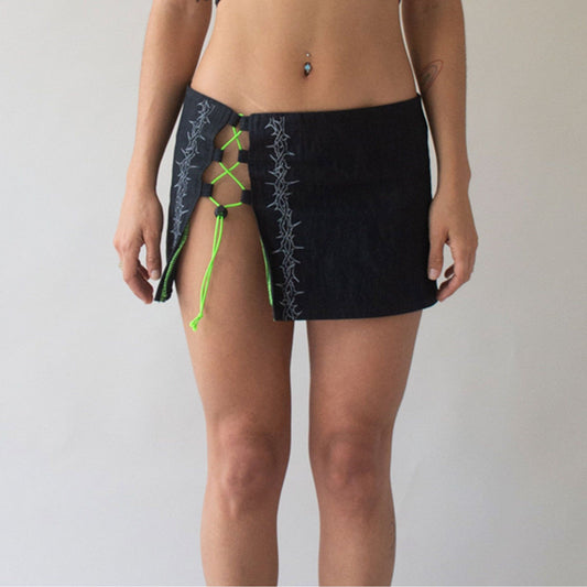 black denim skirt featuring radiant neon elastic accents and Reflective spike pattern